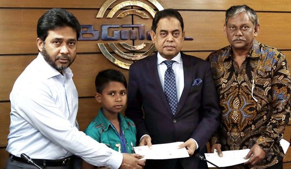 BGMEA handed over group insurance cheques to 27 families